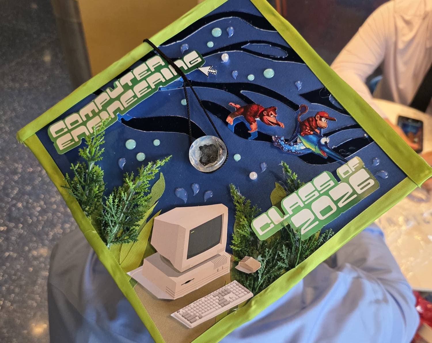 Decorated computer engineering graduation cap with a retro computer design