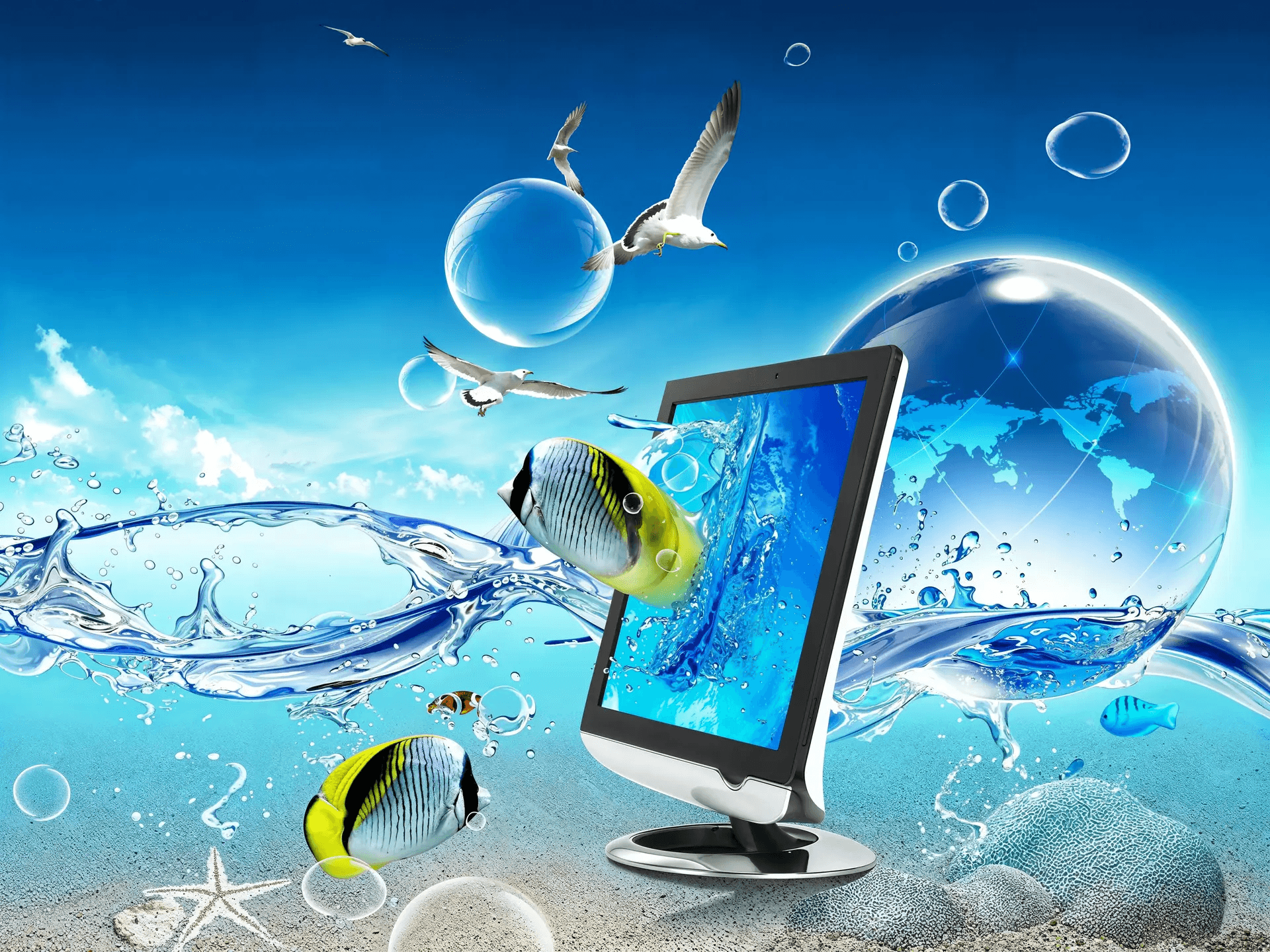 A computer monitor surrounded by tropical fish, clear water, birds, and a blue globe